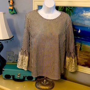 Beautiful blouse with lace detail on bell sleeves